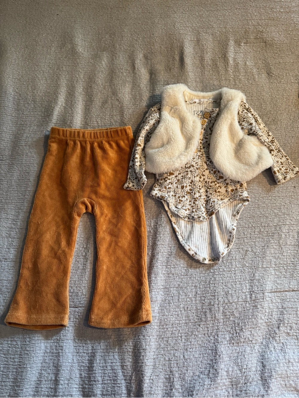 Neutral Floral Bodysuit with Cream Faux Fur Vest & Rust Corduroy Pants